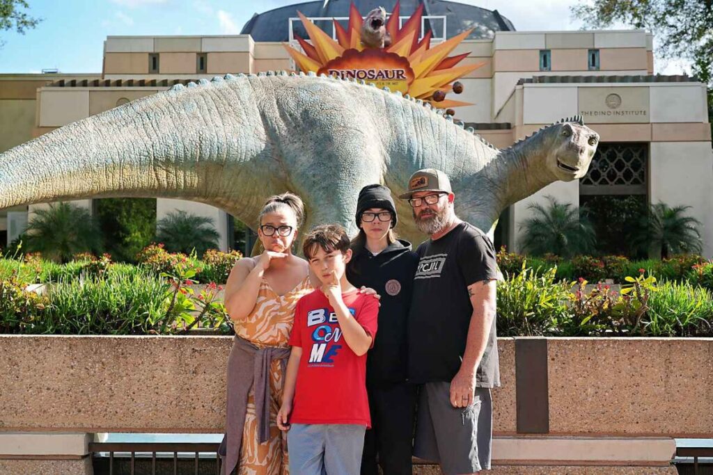 Sad faces with Iguanodon outside Dinosaur