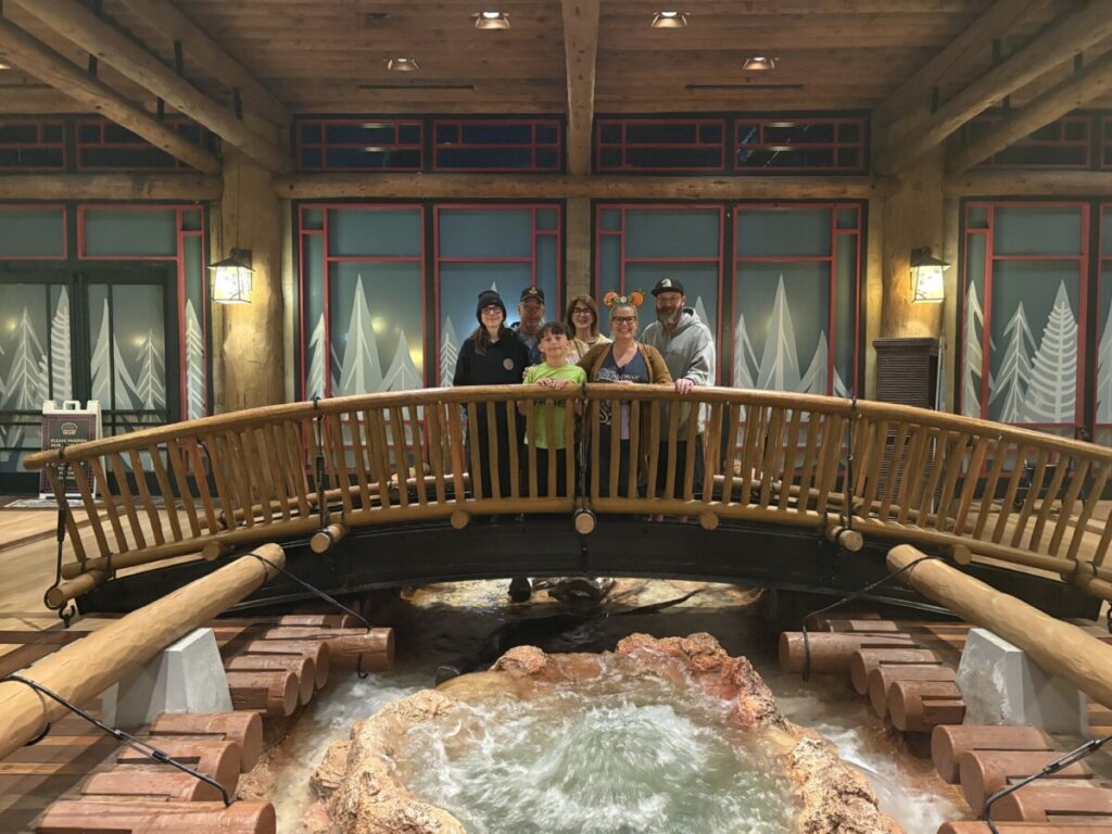 Family picture on the Wilderness Lodge lobby bridge
