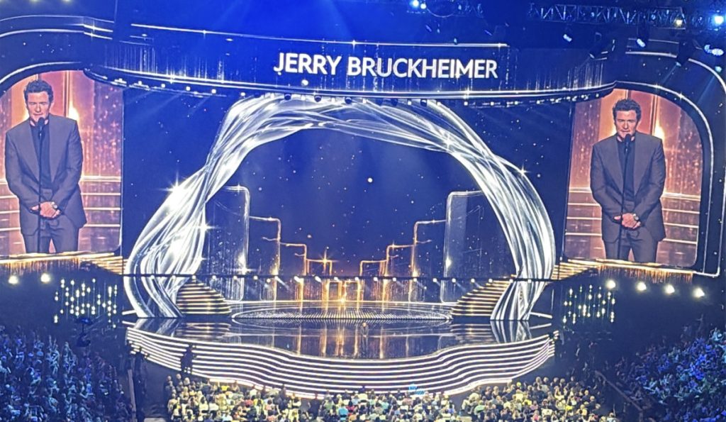 Orlando Bloom presenting Jerry Bruckheimer his Disney Legend award at D23 the ultimate Disney fan event 2026