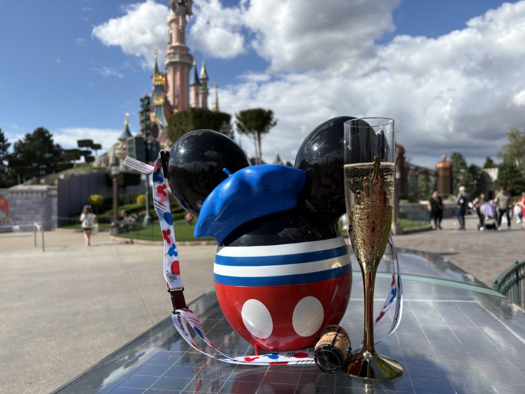 Souvenir flute of champagne, cork and French Mickey popcorn bucket in Disneyland Paris