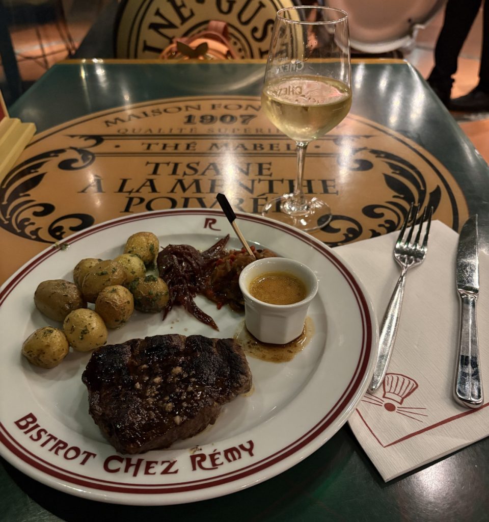 Grilled steak and potatoes with the Café de Paris sauce at Bistrot Chez Remy in Disney Adventure World
